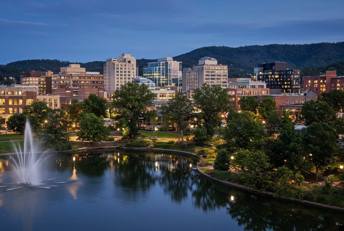 Dusk over a North Alabama city skyline, muted and professional